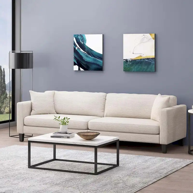 Canapé 3 places moderne beige 101 avec pieds en bois et deux oreillers pour salon